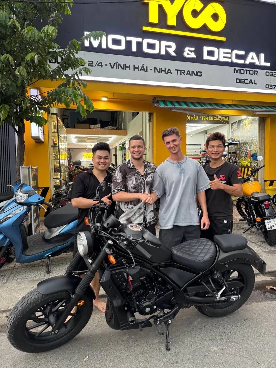 Group motorcycle handover at the workshop